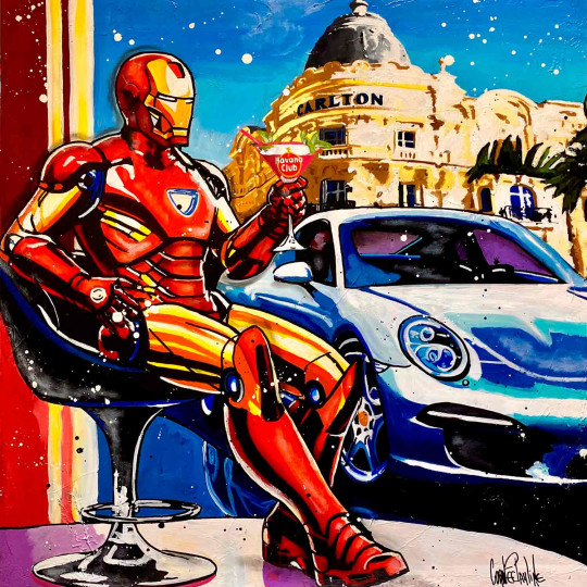 Iron Man enjoys a cocktail next to Porsche